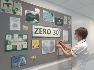 Eye Hospital staff member adding content to a Zero30 notice board