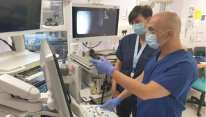 Doctor and nurse preparing equipment for endoscopy