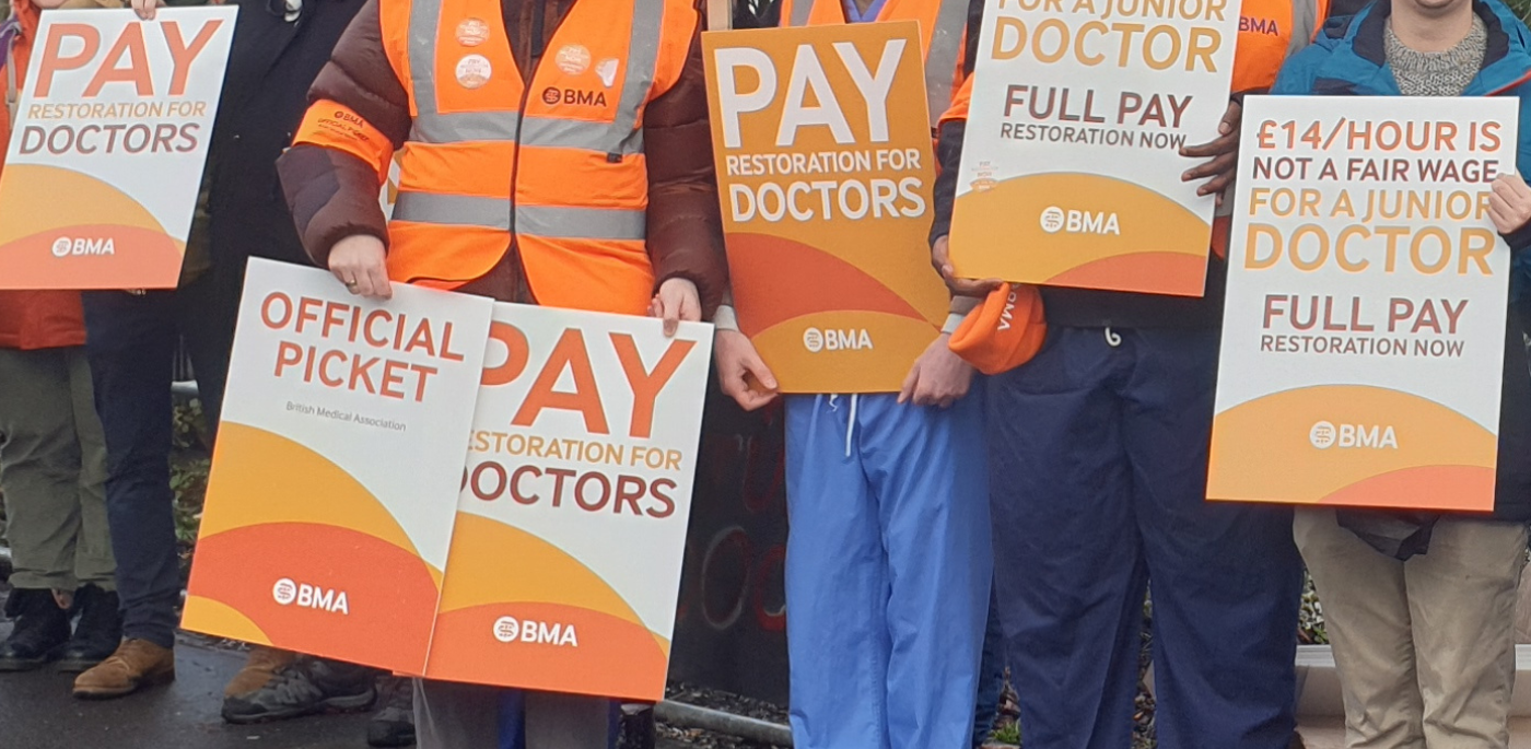 BMA strike placards held by junior doctors on picket line