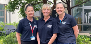 Members of the Teenage and Young Adult cancer team in a garden setting