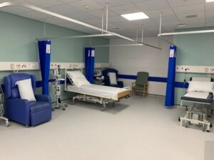 Maternity triage unit with beds, chairs and curtains