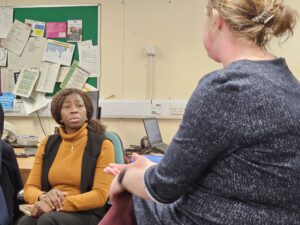 Bola (left) chats to Anna from the Homeless Health Service