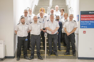 Team of porters standing in the stairwell at Hull Royal Infirmary