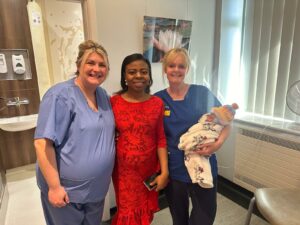 New mum Bukola with midwives and Baby Joshua