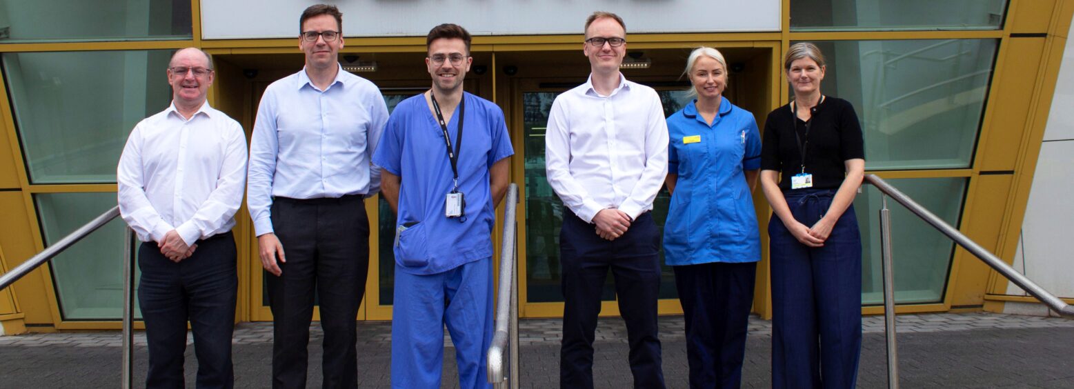 a group of people stood outside a building