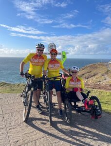 Adrian, Sarah and Jacquie on their bikes and trike at the start line today