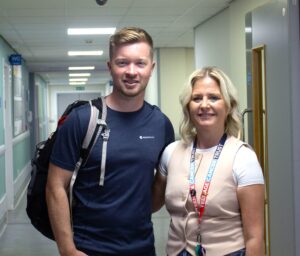 Freddie Cole and Charlene Kent standing in a hospital corridor