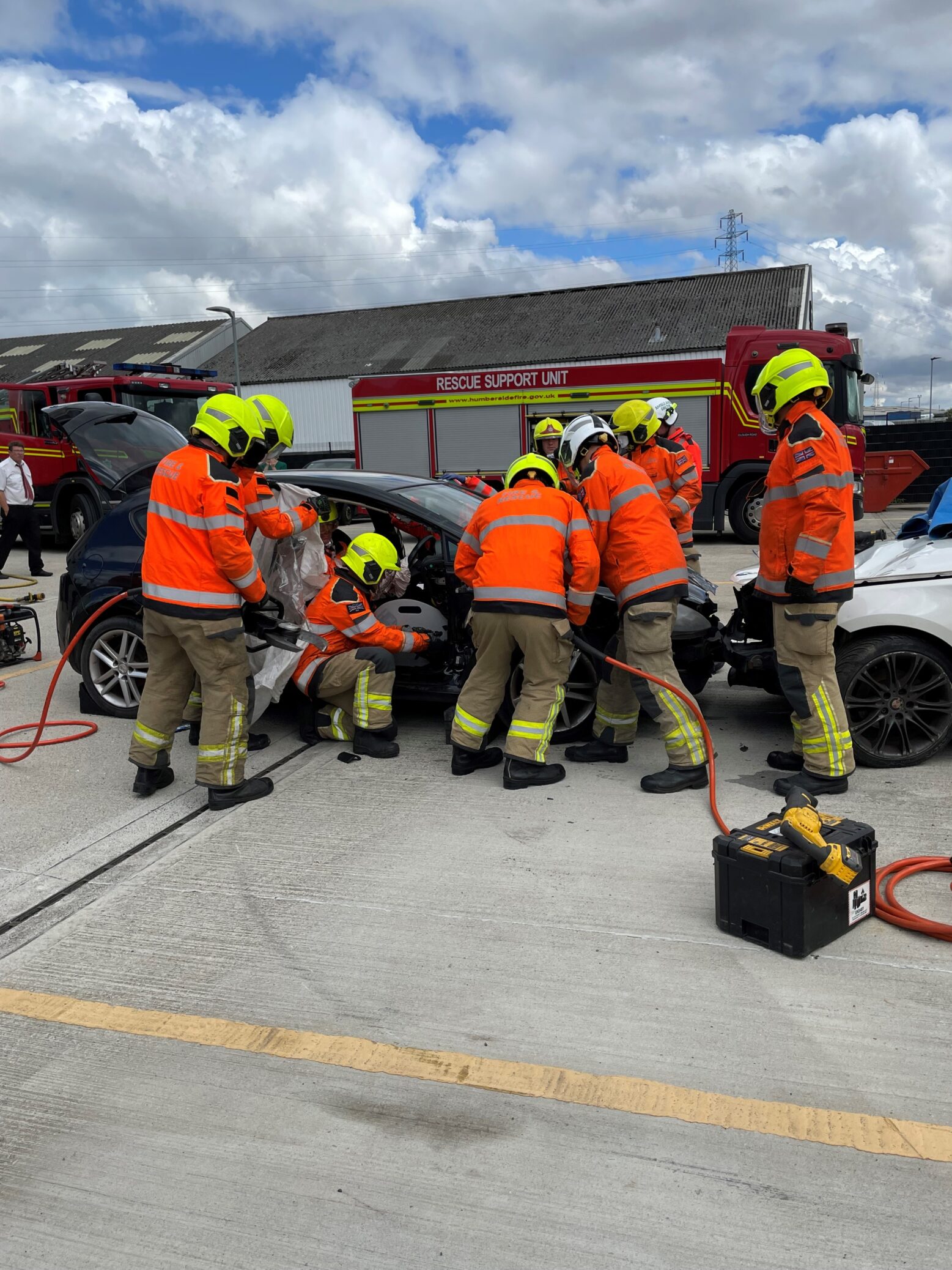 fire fighters around a car wreck