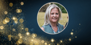 Portrait photo of Charlene Kent on a black background with gold stars