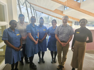 A group of NHS staff pictured inside a building